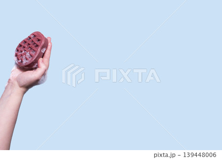 Pink head massager hair brush with silicone flexible hair care and head relaxation. Mock up isolated 139448006