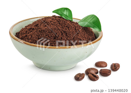 ground coffee in ceramic bowl and coffee beans isolated on white background 139448020