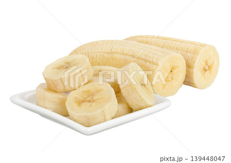 peeled banana pieces in ceramic bowl isolated on white background 139448047