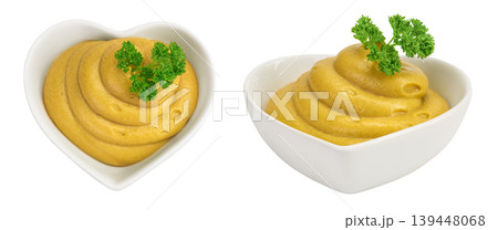 Mustard sauce in ceramic bowl isolated on white background. Top view. Flat lay Mustard sauce in ceramic bowl isolated on white background. Top view. Flat lay 139448068