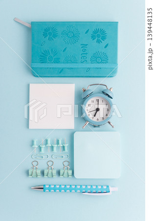 Blue School Stationery Flat Lay with Alarm Clock Blue School Stationery Flat Lay with Alarm Clock 139448135