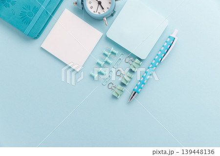Blue School Stationery Flat Lay with Alarm Clock 139448136