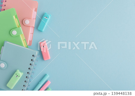 Pastel school supplies flat lay on light blue background 139448138