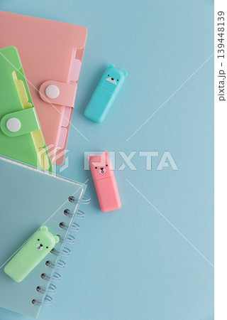 Pastel school supplies flat lay on light blue background 139448139