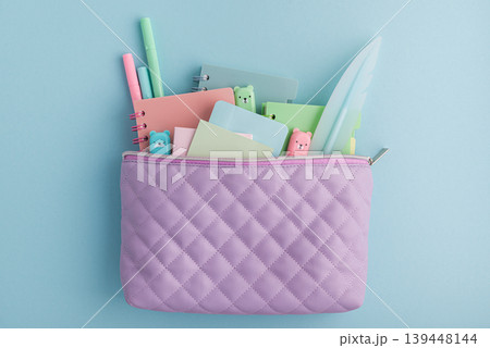 Pastel school supplies filling a quilted pencil case Pastel school supplies filling a quilted pencil case 139448144