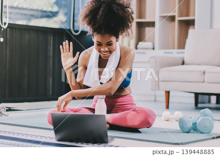 Women exercising in fitness studio yoga classes Women exercising in fitness studio yoga classes 139448885