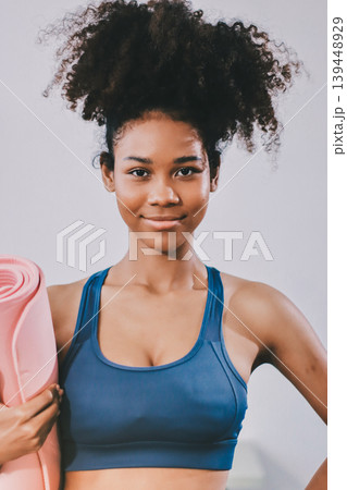 Women exercising in fitness studio yoga classes Women exercising in fitness studio yoga classes 139448929