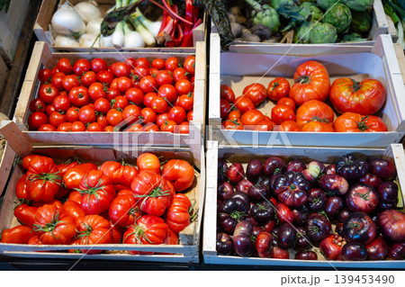 Fresh red tomatoes displayed on store counter for sale 139453490