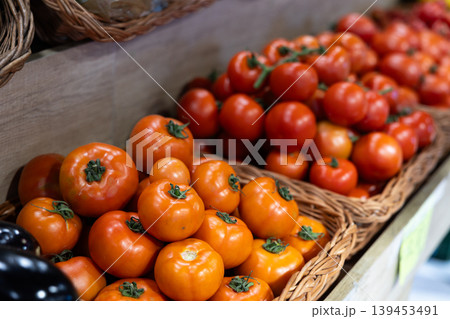 Eco products store counter with large assortment of tomatoes for salent 139453491