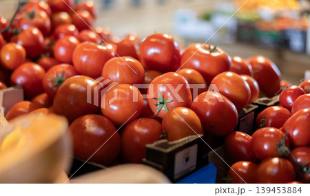 Fresh red tomatoes displayed on store counter for sale 139453884
