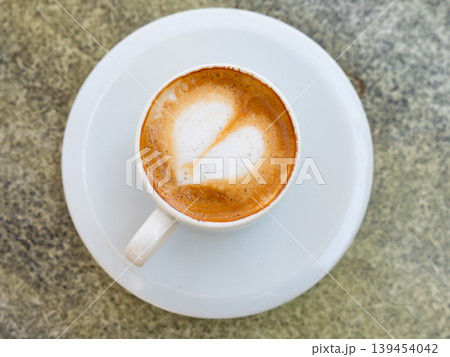 Cortado coffee (espresso macchiato) in small cup 139454042