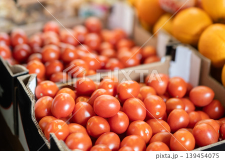 Eco products store counter with large assortment of tomatoes for salent Eco products store counter with large assortment of tomatoes for salent 139454075