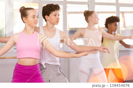 Teenage boy and girl rehearsing paired ballet Teenage boy and girl rehearsing paired ballet 139454076