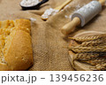 Baking ingredients with rolling pin, flour, and sliced bread 139456236