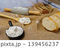 Baking ingredients with rolling pin, flour, and sliced bread 139456237