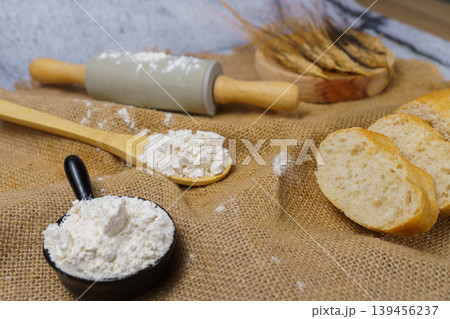 Baking ingredients with rolling pin, flour, and sliced bread Baking ingredients with rolling pin, flour, and sliced bread 139456237