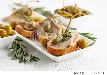 Sandwiches with pate on a white wooden table. 139457791