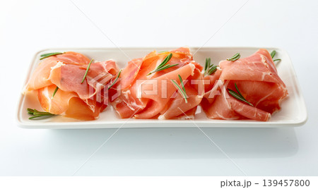 Delicious prosciutto slices with rosemary. 139457800