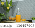 Fresh orange juice in a glass swing-top bottle on a wooden cutting board. 139457902