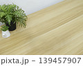 Minimalist wooden desk background with indoor plants for product placement. 139457907