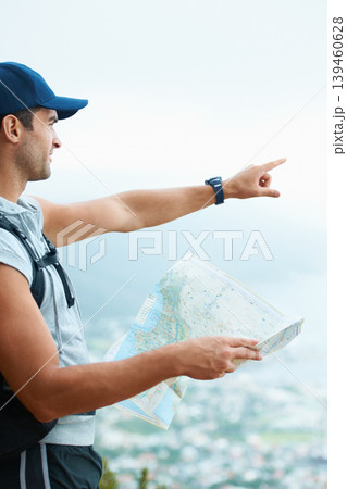 Map, hiking and man with nature, pointing and adventure with direction, journey and fitness. Person, hiker and guy with wellness, outdoor ot document for location, fresh air and landscape with forest 139460628