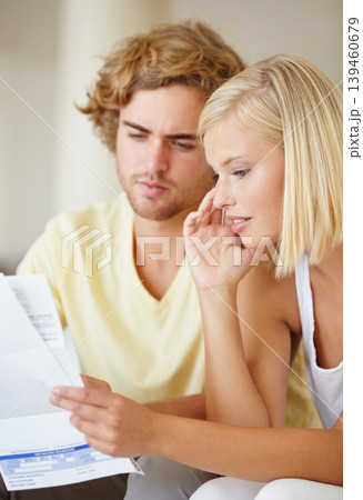 Paper, finance and couple with documents in a house for future planning, investment or asset management. Paperwork, insurance and people in a living room for bills, mortgage or home loan application 139460679