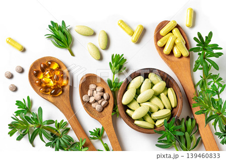 Natural herbal vitamins, plant based supplements and green leaves 139460833