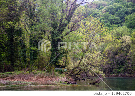 Canyon view in Matka, North Macedonia with boat near green trees Canyon view in Matka, North Macedonia with boat near green trees 139461700