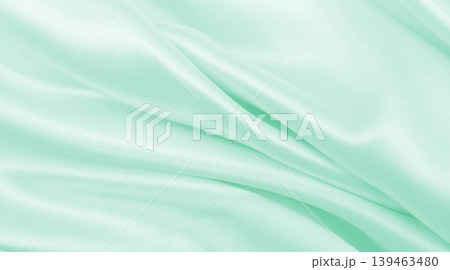 Smooth elegant green silk or satin luxury cloth texture as abstract background. Luxurious background design Smooth elegant green silk or satin luxury cloth texture as abstract background. Luxurious background design 139463480