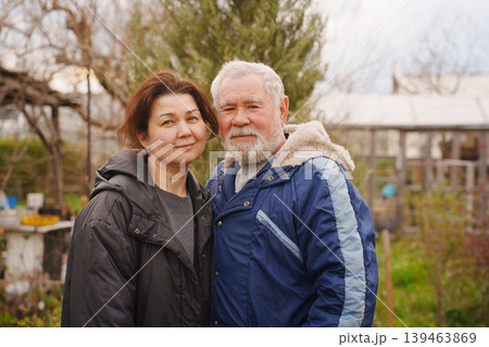 Father and Daughter Standing Together in Backyard Garden Father and Daughter Standing Together in Backyard Garden 139463869