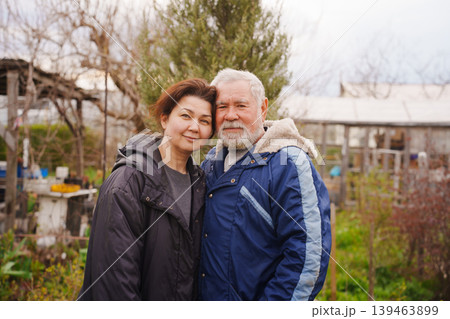 Father and Daughter Standing Together in Backyard Garden Father and Daughter Standing Together in Backyard Garden 139463899
