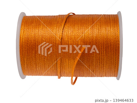 spool of colored thread on a white isolated background spool of colored thread on a white isolated background 139464633