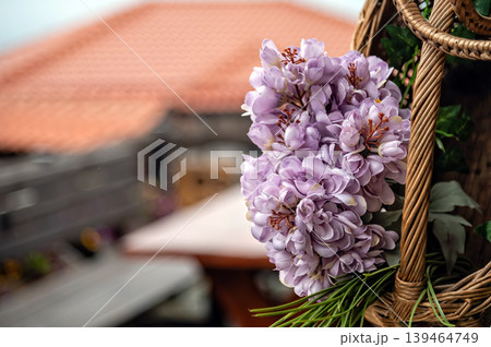 Flowers in a basket are displayed in Skopje, North Macedonia during a sunny day Flowers in a basket are displayed in Skopje, North Macedonia during a sunny day 139464749
