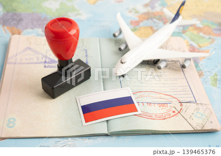 Russia flag with passport and airplane for travel. Russia flag with passport and airplane for travel. 139465376