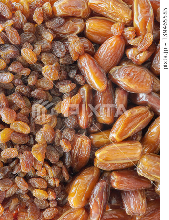 Close up photo of organic dates and raisins, selective focus. 139465585