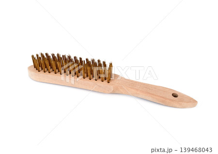a wooden wire brush with brass bristles 139468043