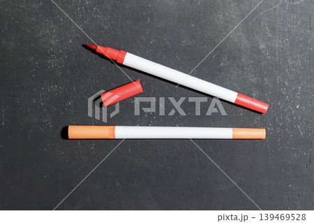 Red and Orange Markers on Dark Background. School and Stationary Supplies. Learning and Education Concept. High quality photo 139469528