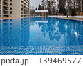 Outdoor swimming pool with clear blue water 139469577