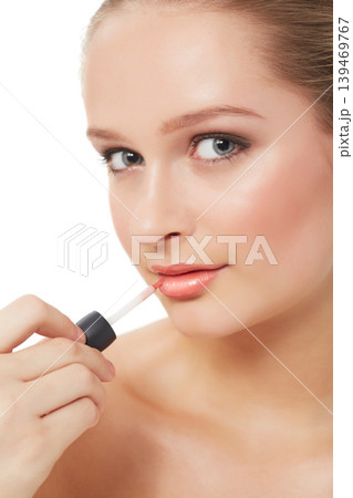 Woman, makeup and beauty with portrait, lipgloss and model for skin, cosmetics on white background. Topless, beautiful and headshot with shine, skincare or clean for glow, closeup or self care Woman, makeup and beauty with portrait, lipgloss and model for skin, cosmetics on white background. Topless, beautiful and headshot with shine, skincare or clean for glow, closeup or self care 139469767