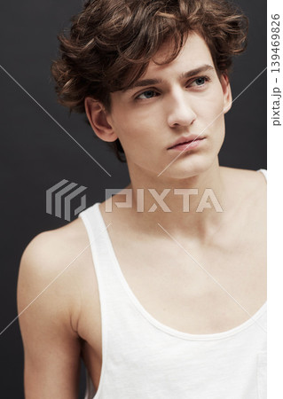 Man, thinking portrait and serious with model, casual fashion and gen z style with confidence in studio. Youth, hipster and male person with cool, trendy and minimalist clothes with black background Man, thinking portrait and serious with model, casual fashion and gen z style with confidence in studio. Youth, hipster and male person with cool, trendy and minimalist clothes with black background 139469826