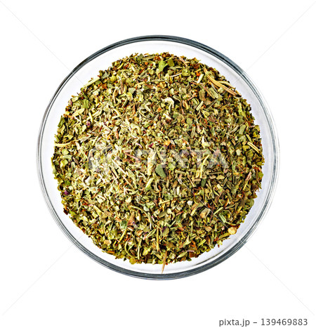 Dried oregano and basil seasoning blend in bowl Dried oregano and basil seasoning blend in bowl 139469883