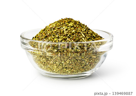 Dried oregano spices filling a glass bowl for cooking Dried oregano spices filling a glass bowl for cooking 139469887