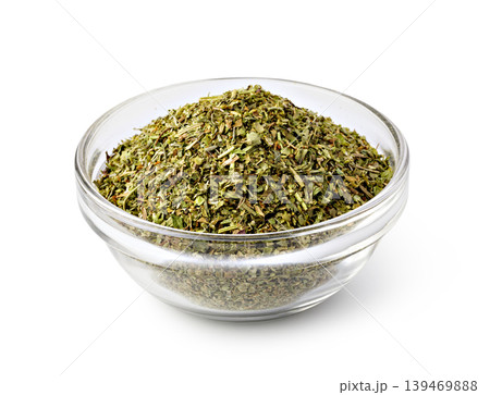 Dried oregano in glass bowl for seasoning and cooking Dried oregano in glass bowl for seasoning and cooking 139469888