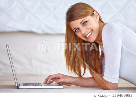 Happy woman, remote work and portrait with laptop on floor of home to update blog post, social media and digital subscription. Freelancer typing on computer for online shopping, email and technology Happy woman, remote work and portrait with laptop on floor of home to update blog post, social media and digital subscription. Freelancer typing on computer for online shopping, email and technology 139469982