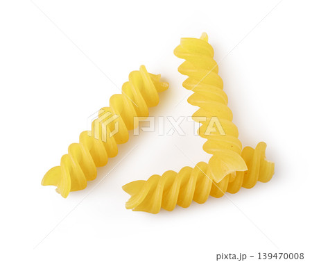 Dry fusilli pasta spirals on white background 139470008