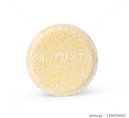 Effervescent yellow tablet standing upright Effervescent yellow tablet standing upright 139470042