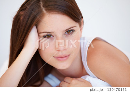 Smile, beauty and portrait of woman on bed for relaxing with positive, good and confident attitude. Happy, calm and young female person from Canada laying and resting in bedroom of modern apartment. Smile, beauty and portrait of woman on bed for relaxing with positive, good and confident attitude. Happy, calm and young female person from Canada laying and resting in bedroom of modern apartment. 139470151