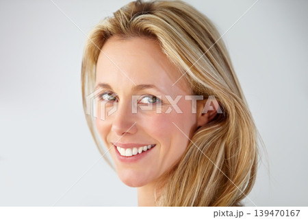 Portrait, mature woman and smile in studio for skincare, natural beauty and facial glow isolated on white background. Face, happy model and anti aging cosmetics for wellness, dermatology and shine Portrait, mature woman and smile in studio for skincare, natural beauty and facial glow isolated on white background. Face, happy model and anti aging cosmetics for wellness, dermatology and shine 139470167