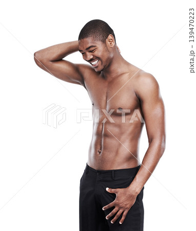 Black man, model and shirtless with smile, six pack and standing on white background confident with abs. Studio backdrop, fit and attractive for health and muscular for fitness, stomach and chest 139470223
