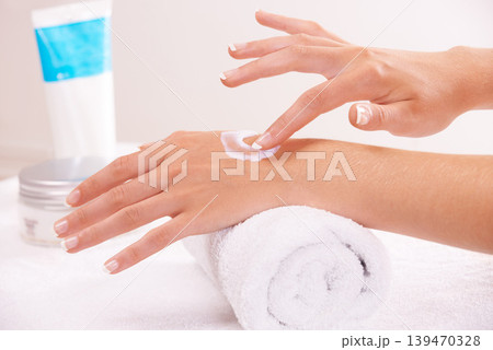 Skincare, cream and hands closeup in spa, touch and massage on towel. Fingers, nails and woman apply lotion in treatment, natural cosmetics and dermatology moisturizer, beauty health and manicure Skincare, cream and hands closeup in spa, touch and massage on towel. Fingers, nails and woman apply lotion in treatment, natural cosmetics and dermatology moisturizer, beauty health and manicure 139470328